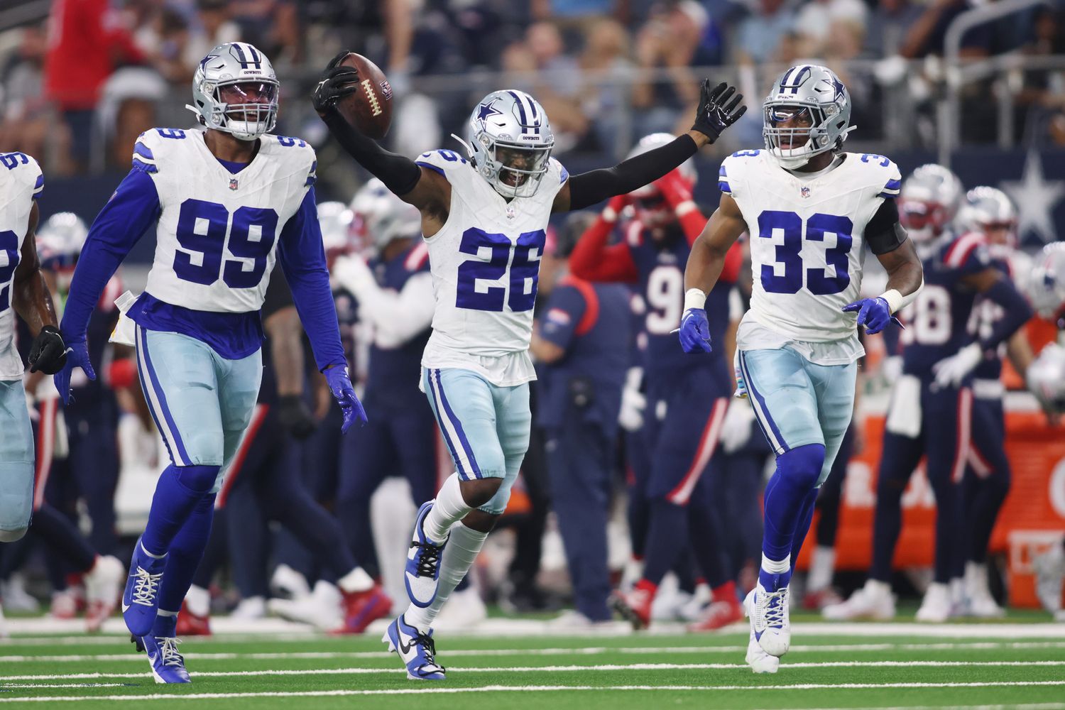 Dallas Cowboys cornerback DaRon Bland (26) celebrates an interception with his teammates in the fourth quarter against the New England Patriots at AT&T Stadium.